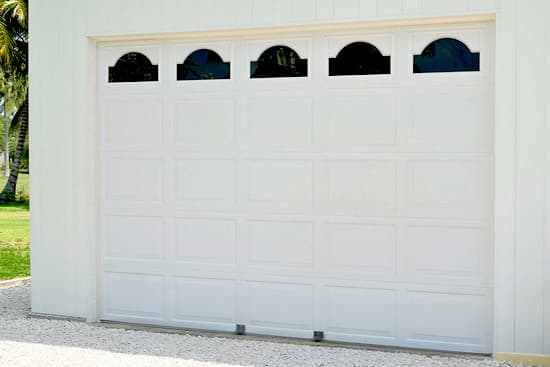 Attached garage with white door