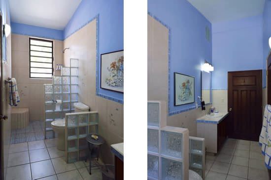 Bathroom with blue painted walls and blue accent tile