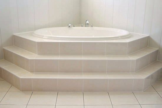 Oval bathtub with steps