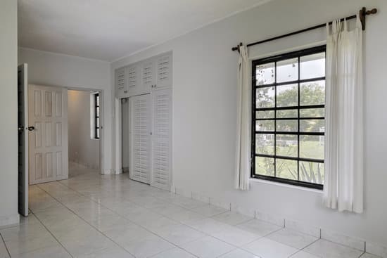 Empty bedroom with light grey painted walls