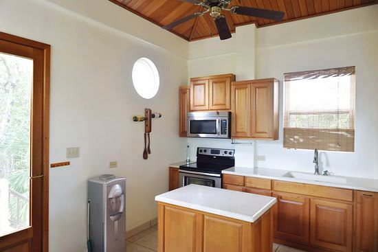 Kitchen with island and cedar cabinets