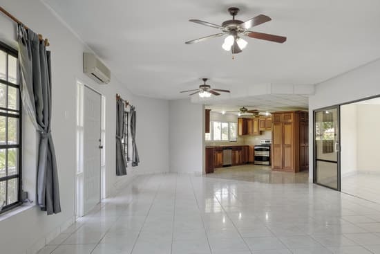Empty living room with light grey painted walls