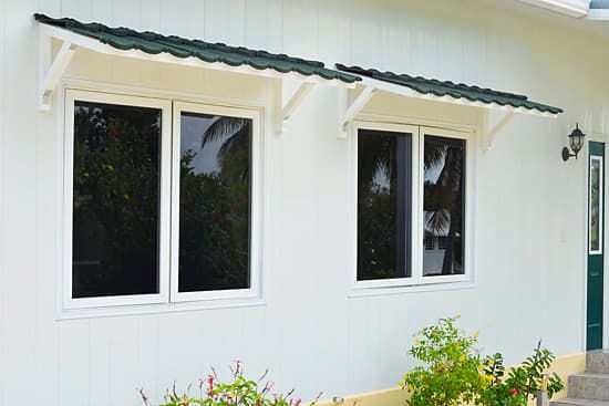 Green metal window awnings
