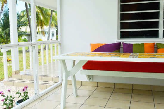 Screened veranda with Mexican tile table