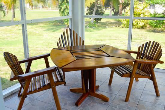 Screened veranda with custom-made hardwood patio furniture